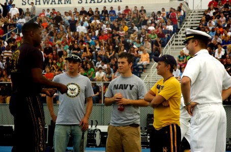 US Navy 070830-N-1805P-003 Special Warfare Boat Operator 1st Class Dave Fisher and Lt. Cmdr. Paul Mountel discuss Navy careers with students of Hamilton High School after a Navy Week performance by the U.S. Navy Parachute Demon