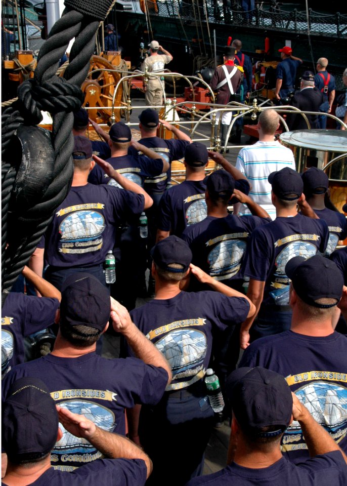 US Navy 070831-N-2893B-001 Chief petty officer (CPO) selectees salute the ensign as the national anthem is played aboard USS Constitution while the ship gets underway