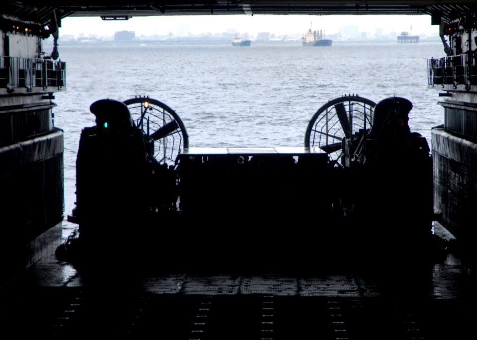 US Navy 070901-N-6710M-025 A landing craft air cushion, carrying Japanese evacuation drill participants, prepares to enter the well deck of USS Tortuga (LSD 46)