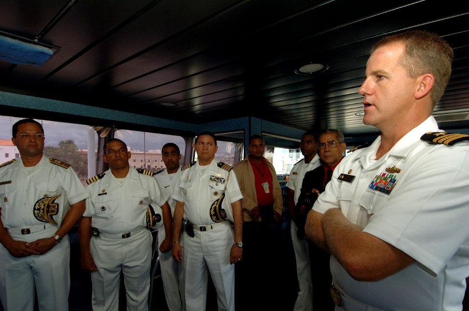 US Navy 070902-N-0989H-062 Cmdr. Rob Morrison, commanding officer of High Speed Vessel (HSV 2) Swift, discusses the ship's capabilities with Vice Adm. Julio Cesar Bayonet, Chief of Staff of the Dominican Republic Navy photo