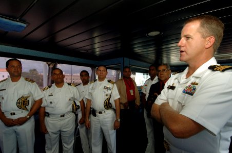 US Navy 070902-N-0989H-062 Cmdr. Rob Morrison, commanding officer of High Speed Vessel (HSV 2) Swift, discusses the ship's capabilities with Vice Adm. Julio Cesar Bayonet, Chief of Staff of the Dominican Republic Navy photo
