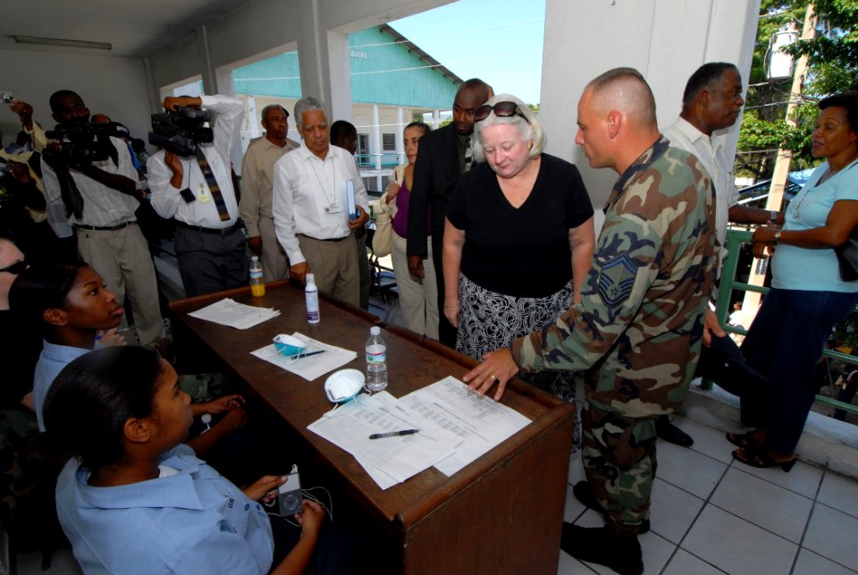 US Navy 070902-N-8704K-059 U.S. Ambassador to Haiti Janet Sanderson is guided by Senior Master Sgt. Steven Foster on a tour of Hopital De L'universite D'etat D'Haiti, where Military Sealift Command hospital ship USNS Comfort (T