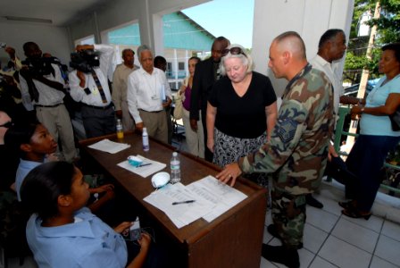 US Navy 070902-N-8704K-059 U.S. Ambassador to Haiti Janet Sanderson is guided by Senior Master Sgt. Steven Foster on a tour of Hopital De L'universite D'etat D'Haiti, where Military Sealift Command hospital ship USNS Comfort (T photo