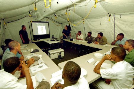 US Navy 070903-N-0989H-013 The U.S. Coast Guard International Training Division conducts outboard motor maintenance training for Dominican Republic sailors during GFS deployment photo