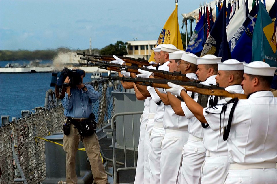 US Navy 070902-N-0995C-043 Naval honor guard members fire a rifle salute to commemorate the end of World War II in a ceremony held aboard the USS Missouri Memorial