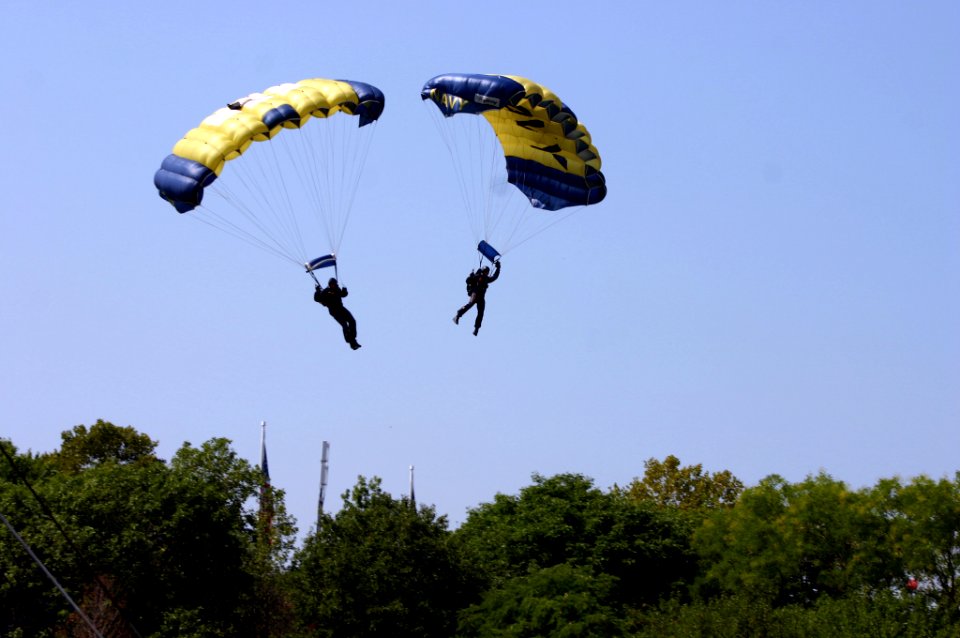US Navy 070902-N-7163S-002 Two members of the U.S. Navy's Parachute Demonstration Team, the Leap Frogs, land at the Cincinnati Riverfest