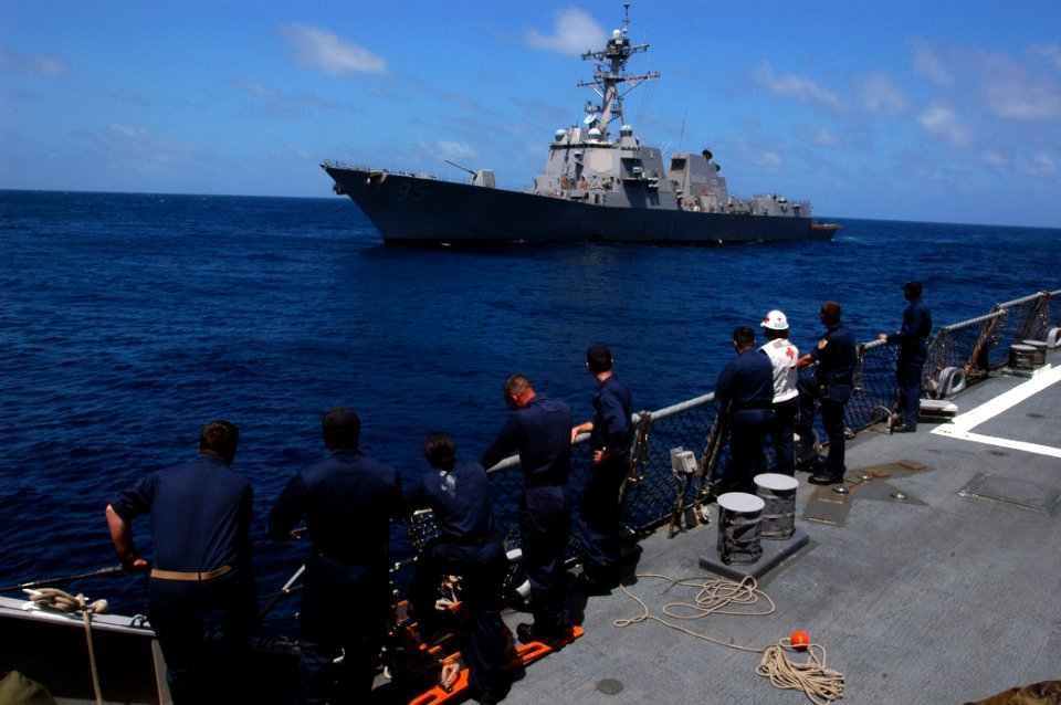 US Navy 070904-N-4014G-048 Sailors aboard guided-missile destroyer USS Porter (DDG 78) watch as USS James E. Williams (DDG 95) pulls alongside for a personnel transfer via a rigid hull inflatable boat