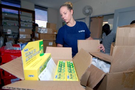 US Navy 070905-N-8704K-028 U.S. Coast Guard Health Services Technician 2nd Class Janelle Smith, attached to Military Sealift Command hospital ship USNS Comfort (T-AH 20), stocks a pharmacy at Hôpital Universitaire de la Paix