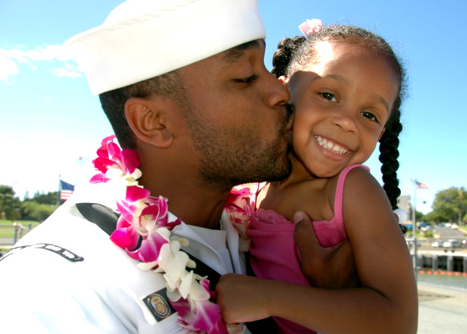US Navy 070904-N-0879R-008 A Sailor from guided-missile cruiser USS Lake Erie (CG 70) greets his daughter upon the ship's return home following a four-month deployment to the Western Pacific in support of 7th Fleet