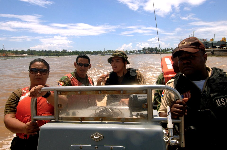 US Navy 070904-N-0989H-044 Master-at-Arms 3rd Class Sigredo Santiago, of U.S. Navy Expeditionary Training Command, trains Dominican Republic sailors on a seven-meter rigid hull inflatable boat