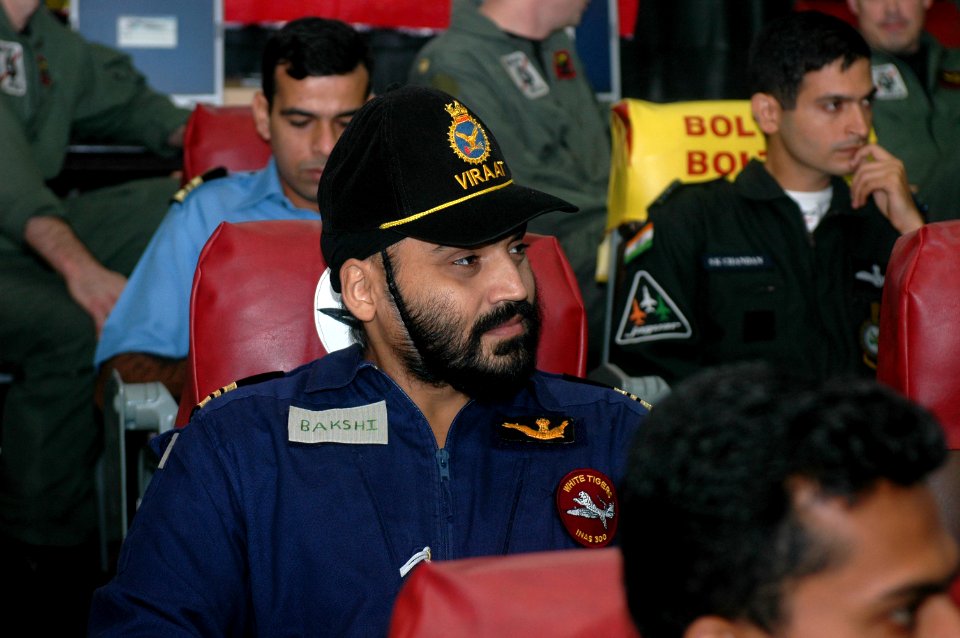 US Navy 070904-N-5148B-008 Indian naval and air force personnel listen to a brief in the ready room aboard nuclear-powered aircraft carrier USS Nimitz (CVN 68)