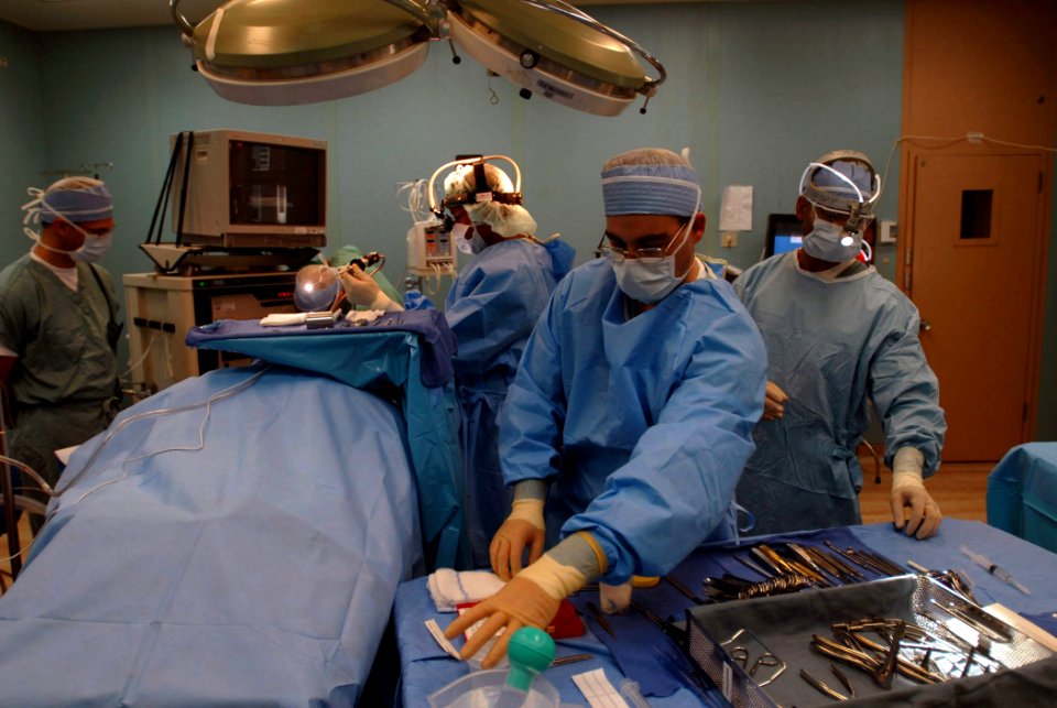 US Navy 070906-N-4238B-006 Medical personnel attached to Military Sealift Command hospital ship USNS Comfort (T-AH 20) prepare for surgery aboard the ship while anchored off the coast of Haiti