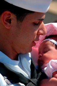 US Navy 070904-N-0879R-012 A Sailor from guided-missile cruiser USS Lake Erie (CG 70) meets his daughter for the first time upon the ship's return home following a four-month deployment to the Western Pacific in support o