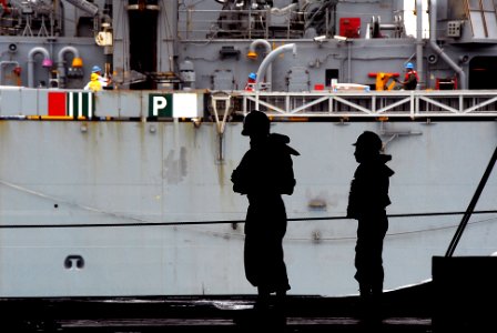 US Navy 070903-N-9760Z-094 Sailors aboard nuclear-powered aircraft carrier USS Nimitz (CVN 68) participate in a replenishment at sea with Military Sealift Command fast-combat support ship USNS Rainier (T-AOE 7)