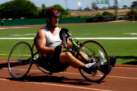 US Navy 070906-N-7498L-262 Army Sgt. Chad Carter dashes to a first-place finish among handcyclers in the Prisoners of War-Missing in Action 5k Run-Walk at Naval Base San Diego photo