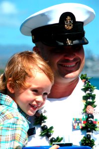 US Navy 070904-N-0879R-009 A Sailor from guided-missile cruiser USS Lake Erie (CG 70) reunites with his family upon the ship's return home following a four-month deployment to the Western Pacific in support of 7th Fleet