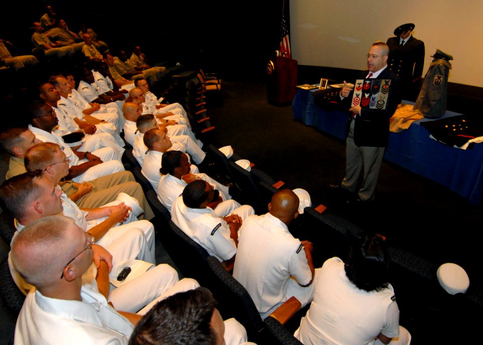 US Navy 070905-N-4459K-027 Mark Hacala, Navy reservist, historian and director of the United States Navy Memorial's Education department, shows chief petty officers selectees from Precommissioning Unit (PCU) George H. W