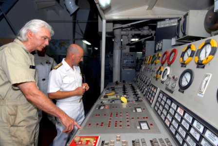 US Navy 070904-N-8704K-042 Civil service mariner Douglas Puritis, chief engineer aboard Military Sealift Command (MSC) hospital ship USNS Comfort (T-AH 20), guides Adm. James Stavridis, commander of U.S. Southern Command, thro