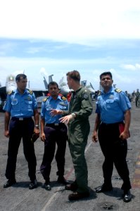 US Navy 070904-N-5148B-082 Cmdr. Thomas Bourbeau gives a tour to members of the Indian Navy on the flight deck aboard nuclear-powered aircraft carrier USS Nimitz (CVN 68)
