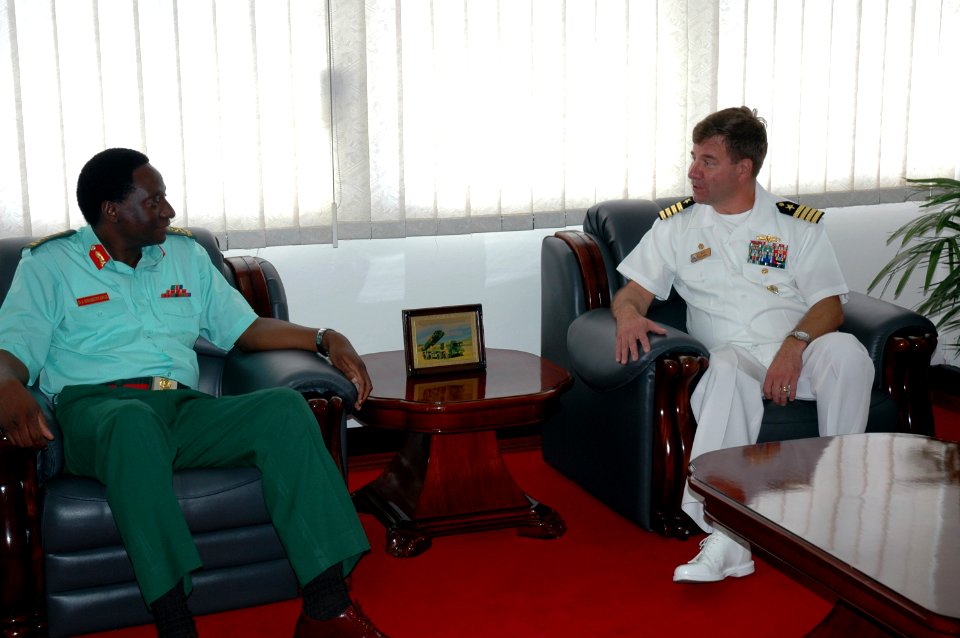 US Navy 070906-N-3255B-001 Capt. Nicholas H. Holman, commander of the U.S. Navy's newly established Southeast Africa Task Group, CTG 60.5, discusses maritime safety and security initiatives with Lt. Gen D.A. Mwamunyange
