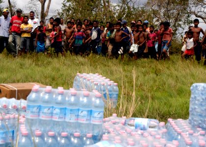 US Navy 070907-N-1189B-214 Nicaraguans wait to collect food and water supplies delivered by Sailors from the multi-purpose amphibious assault ship USS Wasp (LHD 1) photo