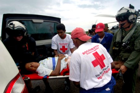 US Navy 070907-N-1810F-021 A woman injured during Hurricane Felix is moved by Nicaraguan Red Cross volunteers from an amphibious assault ship USS Wasp (LHD 1) helicopter, to a local hospital photo