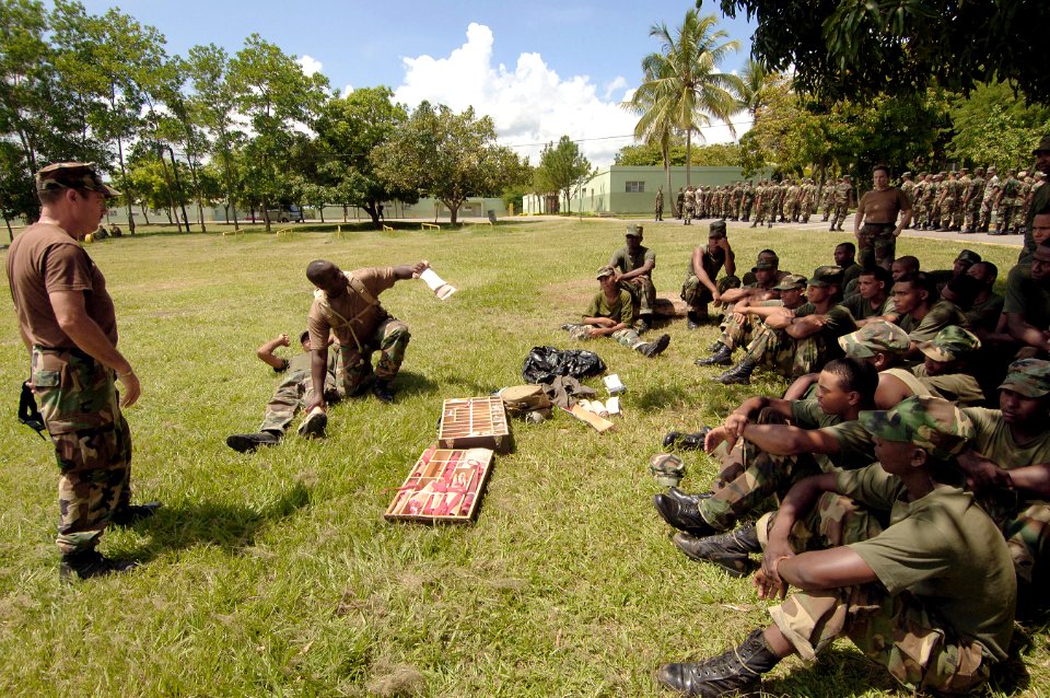 US Navy 070905-N-0989H-003 Hospital Corpsman 1st Class Charles Givens and Master-at-Arms 1st Class Hector Cardona train Dominican Republic soldiers on applying a tourniquet