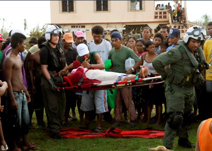 US Navy 070907-N-7540C-004 Sailors assigned to multi-purpose amphibious assault ship USS Wasp (LHD 1) carry an injured Nicaraguan woman to a helicopter as they prepare for a medical evacuation