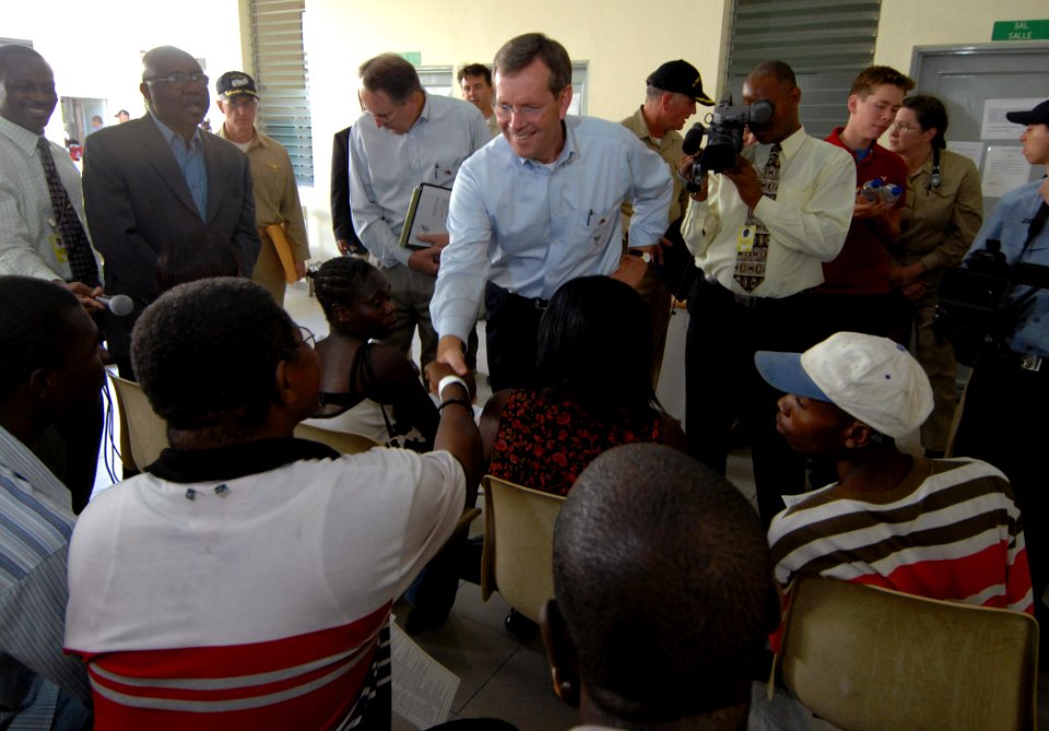 US Navy 070907-N-0194K-202 Secretary of Health and Human Services, Michael Leavitt speaks with Haitian patients awaiting medical care during his tour of the Military Sealift Command hospital ship USNS Comfort (T-AH 20) medical