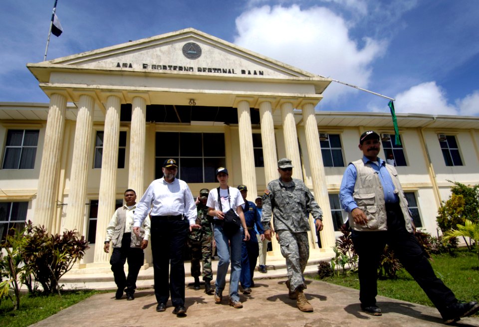US Navy 070908-N-1810F-760 Paul A. Triveili, U.S. Ambassador to Nicaragua, foreground left, leaves government offices after meeting U.S. military personnel participating in Hurricane Felix disaster relief operations
