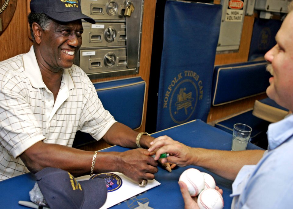 US Navy 070907-N-7441H-004 Sports celebrity Paul Blair autographs baseballs for Sailors aboard attack submarine USS Norfolk (SSN 714)