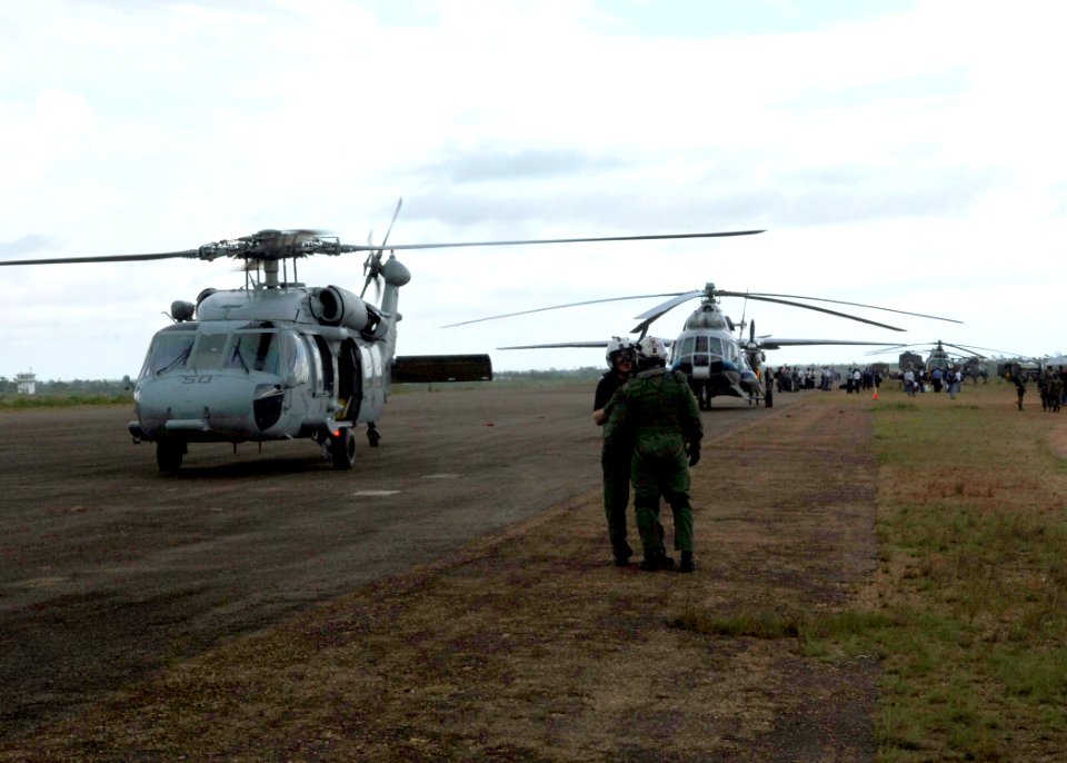 US Navy 070907-N-7540C-009 Naval aircrew attached to multi-purpose amphibious assault ship USS Wasp (LHD 1) stand on the flight line while assisting with disaster relief efforts in Nicaragua