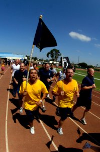 US Navy 070906-N-7498L-497 Sailors selected for promotion to chief petty officer and more than 3,000 other military personnel participate in the Prisoners of War-Missing in Action 5k Run-Walk at Naval Base San Diego