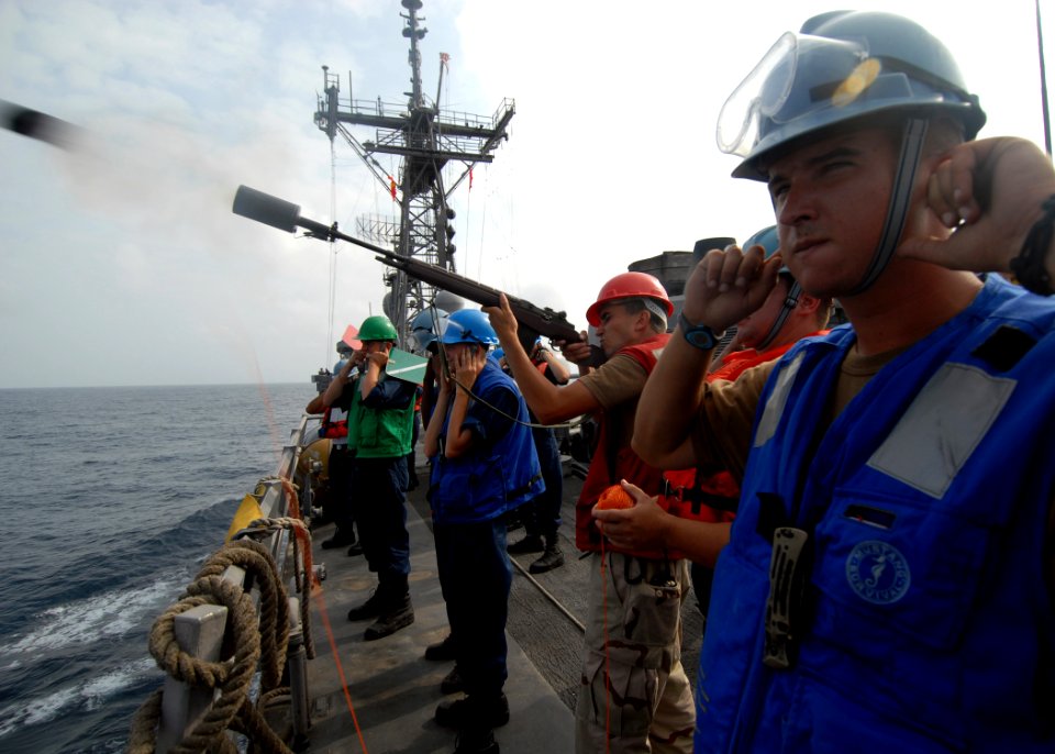US Navy 070909-N-0841E-404 Gunner's Mate 3rd Class James Lundell fires a shot line aboard guided-missile frigate USS Carr (FFG 52) toward Military Sealift Command fleet replenishment oiler USNS Tippecanoe (T-AO 199) durin