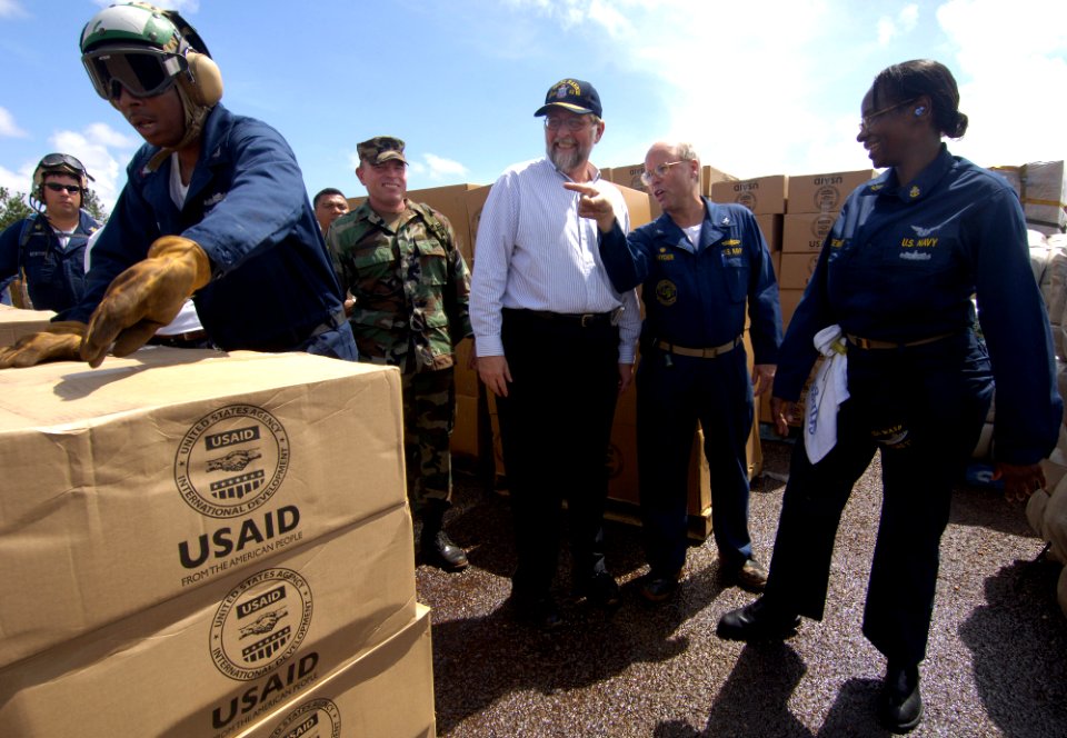 US Navy 070908-N-1810F-457 Paul A. Triveili, U.S. Ambassador to Nicaragua, center, and USS Wasp (LHD 1) Expeditionary Strike Group Commodore Randy Snyder review Wasp's Hurricane Felix disaster relief operations