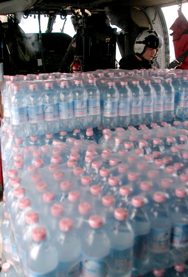 US Navy 070907-N-1189B-137 An MH-60S helicopter from the amphibious assault ship USS Wasp (LHD 1) prepares to deliver bottled water to local residents during Hurricane Felix disaster relief operations