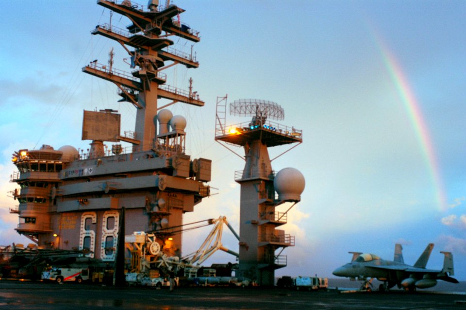 US Navy 070910-N-5148B-057 A rainbow appears above nuclear-powered aircraft carrier USS Nimitz (CVN 68) prior to sunset