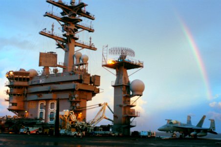 US Navy 070910-N-5148B-057 A rainbow appears above nuclear-powered aircraft carrier USS Nimitz (CVN 68) prior to sunset