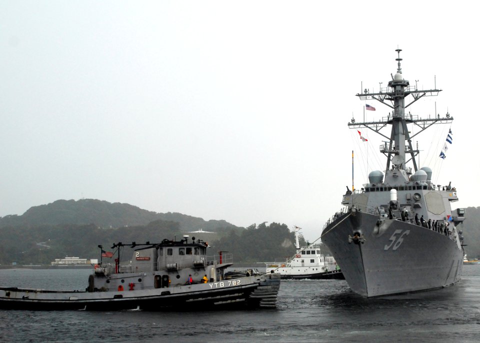 US Navy 070910-N-2638R-001 Large harbor tug Manistee (YTB 782) pulls Arleigh Burke-class guided-missile destroyer USS John S. McCain (DDG 56) away from the pier at Commander Fleet Activities Yokosuka