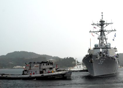 US Navy 070910-N-2638R-001 Large harbor tug Manistee (YTB 782) pulls Arleigh Burke-class guided-missile destroyer USS John S. McCain (DDG 56) away from the pier at Commander Fleet Activities Yokosuka