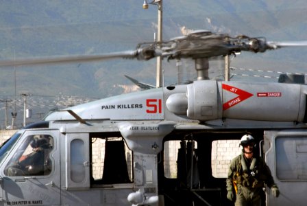 US Navy 070907-N-8704K-026 Aviation Warfare Systems Operator 2nd ClassRussel Moldenhauer, attached to Military Sealift Command hospital ship USNS Comfort (T-AH 20), stands by an MH-60S Seahawk attached to Helicopter Sea Combat