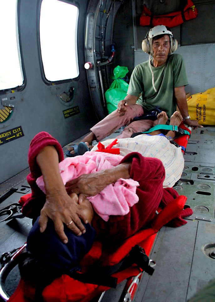 US Navy 070907-N-7540C-011 An injured passenger tries to calm herself just before take-off during a medical evacuation
