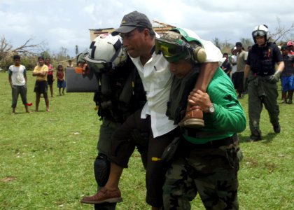 US Navy 070907-N-7540C-039 Sailors from the multipurpose amphibious assault ship USS Wasp (LHD 1) carry an injured citizen of Puerto Cabezas, Nicaragua to waiting aircraft