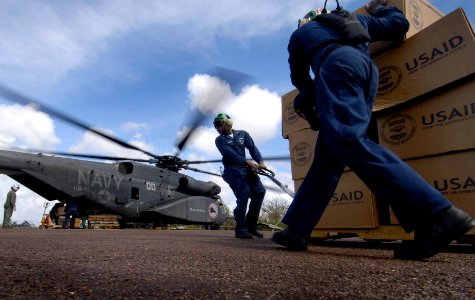 US Navy 070908-N-1810F-233 Navy personnel prepare to load disaster relief supplies onto a helicopter for delivery to Nicaraguans hit by Hurricane Felix photo