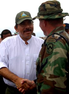 US Navy 070907-N-1810F-237 Lt. Col. Robert Gaddis meets with Daniel Ortega, president of Nicaraguan to discuss a humanitarian relief operation in Puerto Cabezas, Nicaragua photo