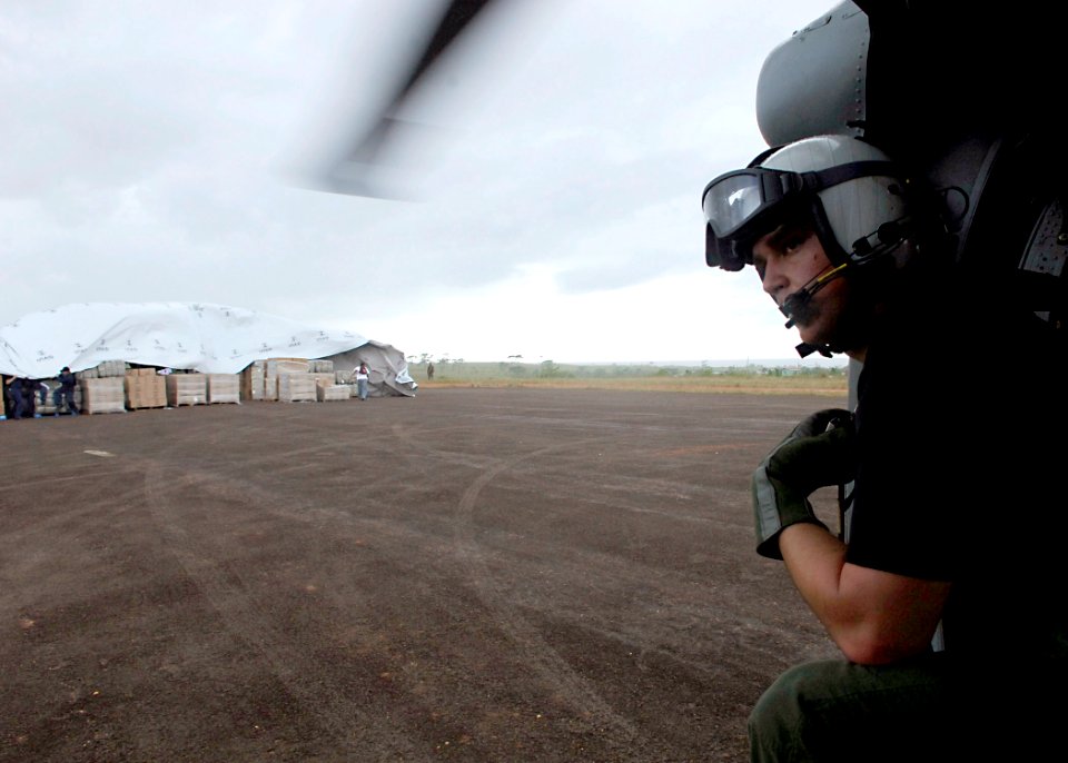US Navy 070907-N-7540C-012 A Navy Search and Rescue (SAR) swimmer prepares for take-off after offloading supplies in Nicaragua