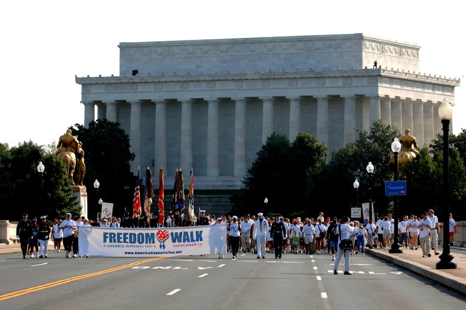 US Navy 070909-N-3642E-139 The America Supports You banner leads National Freedom Walk participants onto the Memorial Bridge toward Arlington, Va