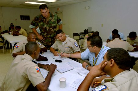 US Navy 070910-N-0989H-005 Lt. j.g. David Macias, of Expeditionary Training Command, helps Dominican Port Authority and port security personnel develop a risk analysis matrix as part of the Global Fleet Station (GFS) pilot depl photo