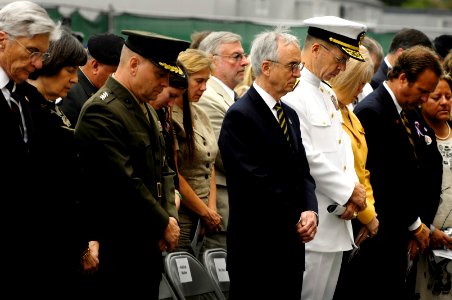 US Navy 070911-D-7203T-006 Deputy Secretary of Defense Gordon England, center, and Chief of Naval Operations Adm. Mike Mullen observe a moment of silence during a remembrance and wreath laying ceremony at the Pentagon photo