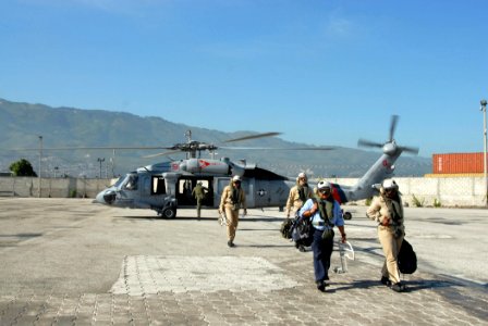 US Navy 070907-N-8704K-023 Military Sealift Command hospital ship USNS Comfort (T-AH 20) personnel depart an MH-60S Seahawk assigned to Helicopter Sea Combat Squadron (HSC) 28